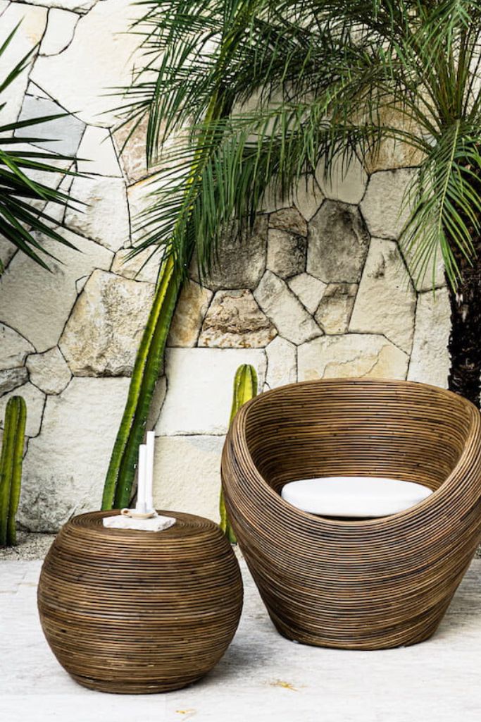Multifunctional brown round rattan table for use as a coffee table, side table, or decorative piece