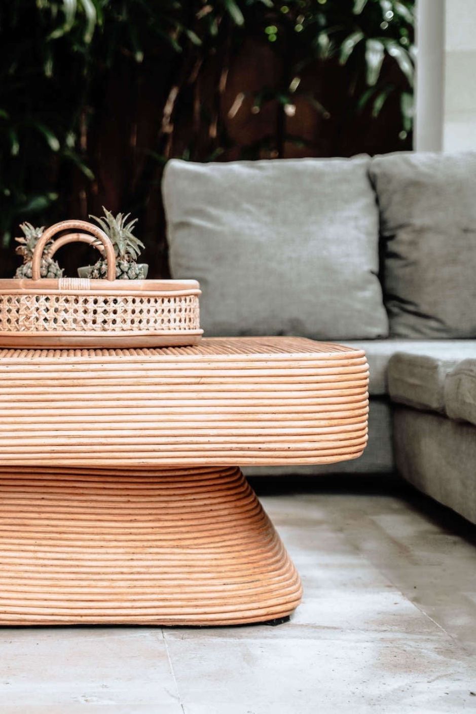 Coastal style natural rattan table Tegal Carla Square with tilted pedestal, handmade artisan furniture for living room, swimming pool or lounge spaces.