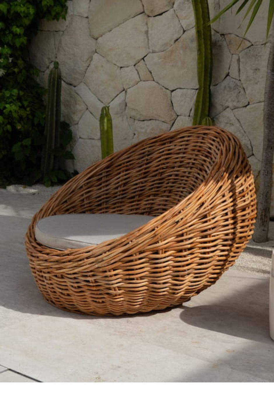 Ingka Halo cognac handmade rattan sofa lounge chair with thick weave, modern minimalist design for living rooms and lounges.