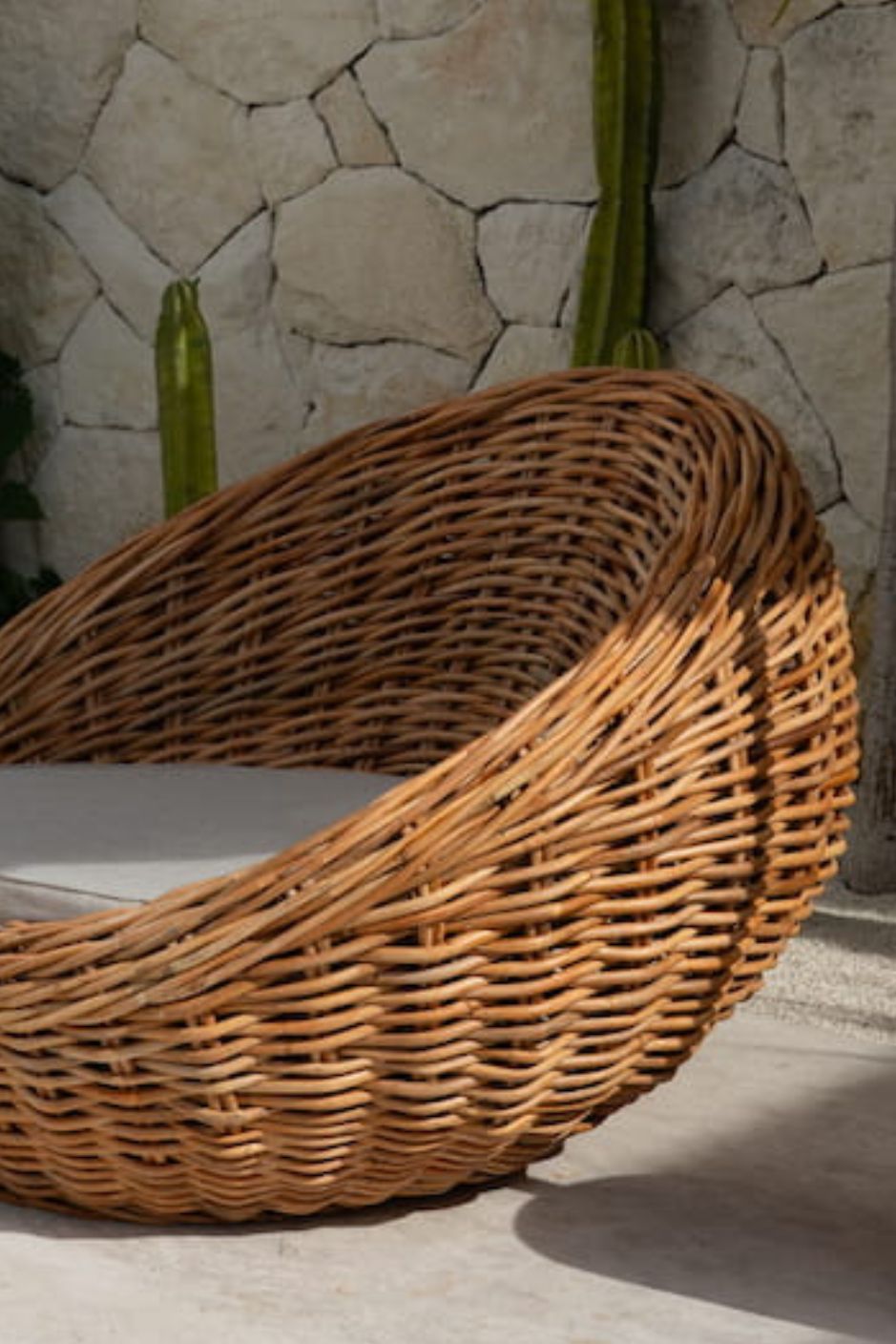 Ingka Halo cognac handmade rattan sofa lounge chair with thick weave, modern minimalist design for living rooms and lounges.