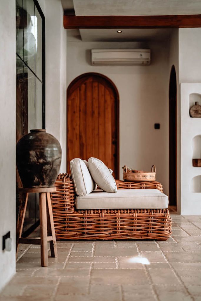 Handmade Ingka modular armchair in cognac rattan with thick weave, versatile as standalone chair or part of modular sofa for living room, terrace, or patio.