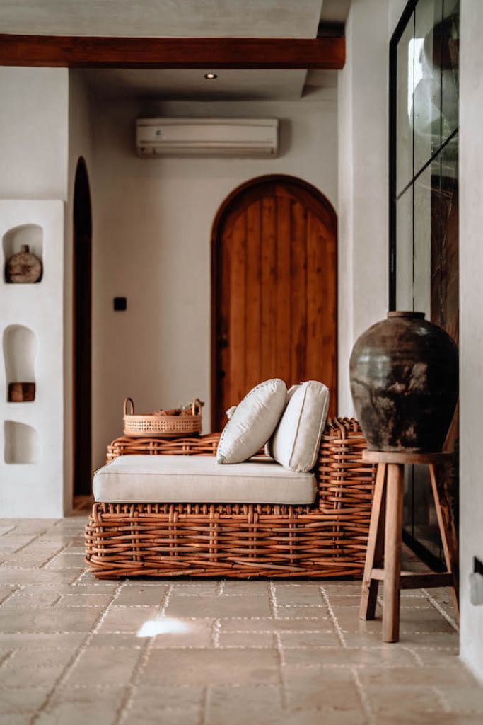 Handmade Ingka modular armchair in cognac rattan with thick weave, versatile as standalone chair or part of modular sofa for living room, terrace, or patio.