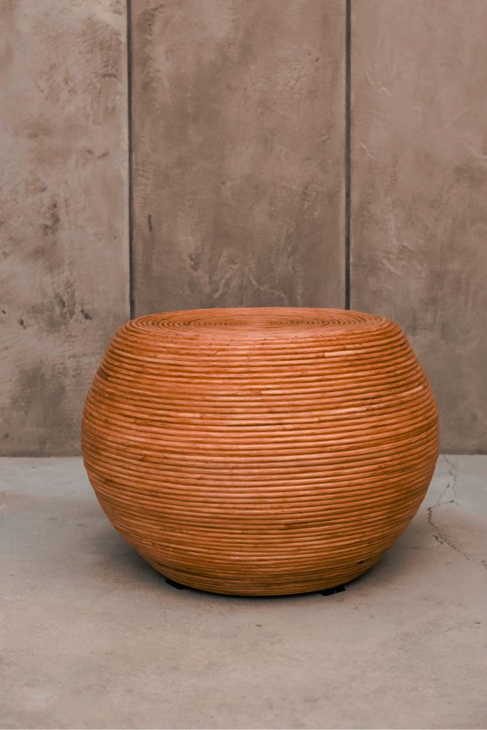 Multifunctional cognac round rattan table for use as a coffee table, side table, or decorative piece
