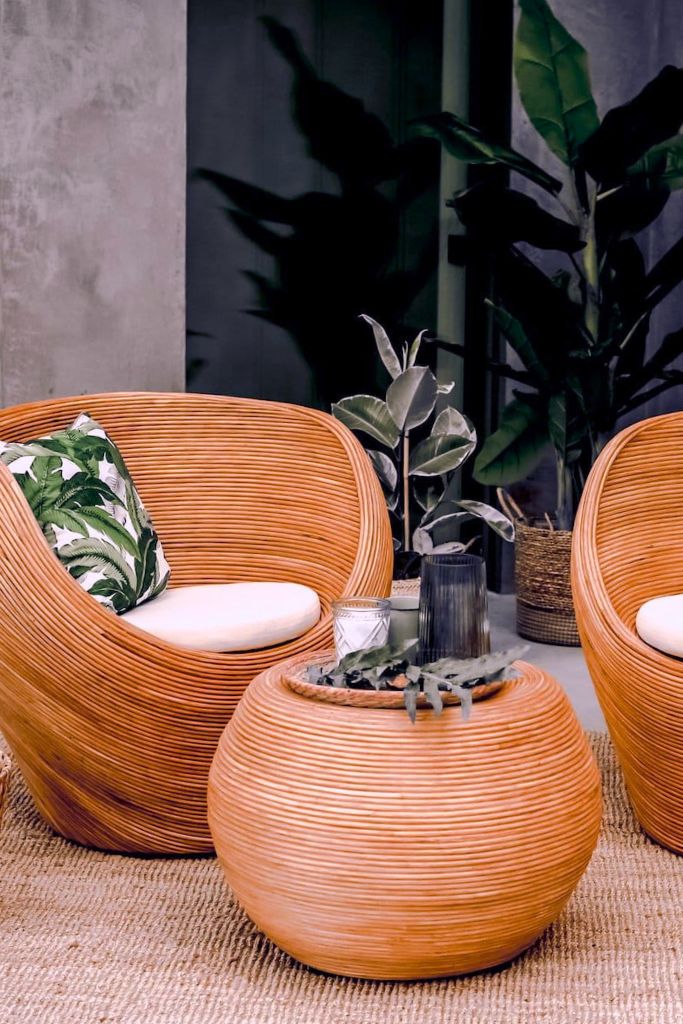 Multifunctional cognac round rattan table for use as a coffee table, side table, or decorative piece