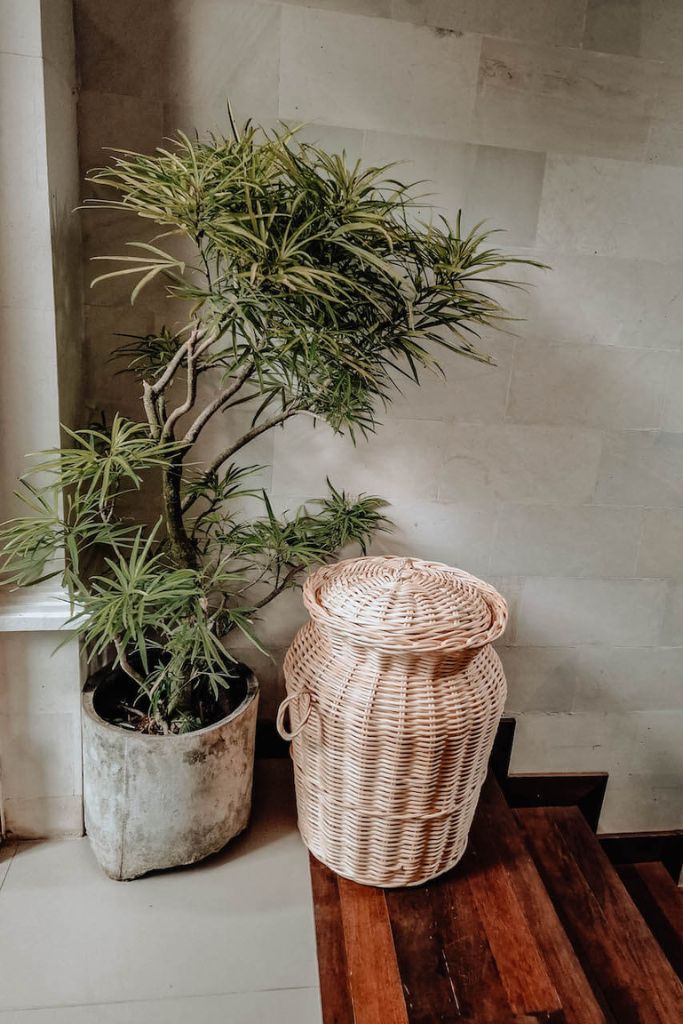 Handwoven Loomi Basket made from natural rattan, eco-friendly storage solution for bedrooms, bathrooms, living rooms, and laundry rooms, lightweight and durable, rustic and stylish home organisation accessory.