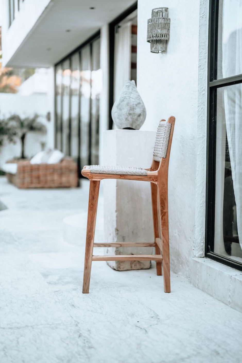 Handmade Harrison teak bar stool with woven synthetic seat and backrest, stylish and durable high chair for kitchen counters or bar tables, perfect for modern Australian interiors.