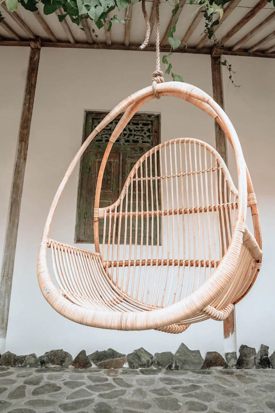 Henry single or double handmade durable light rattan hanging chair for indoor living rooms, covered terraces, patios, balconies, and outdoor gardens