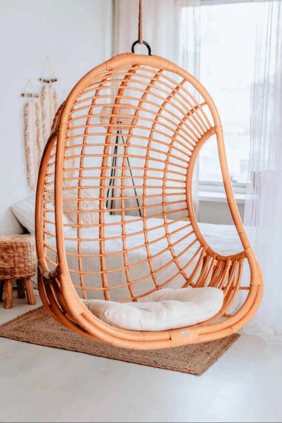 Hugo Rattan Hanging Chair in natural, cognac and brown rattan, handmade, eco-friendly, zero plastic, boho style, perfect for living room, terrace, or patio, stylish and comfortable swinging chair for modern or island-inspired interiors.