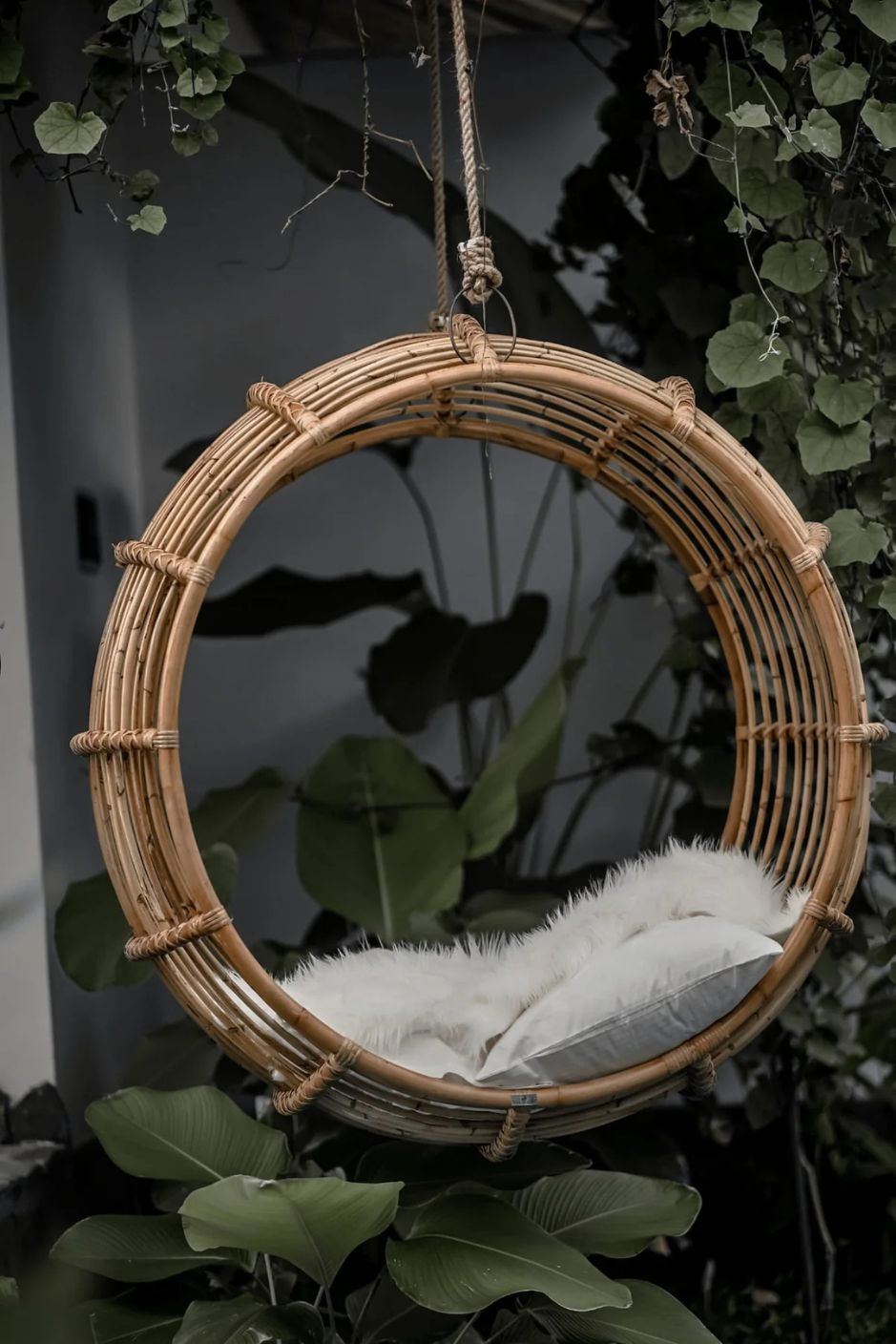 Durable handmade natural rattan hanging swing chair single, designed for relaxing indoor or outdoor comfort.