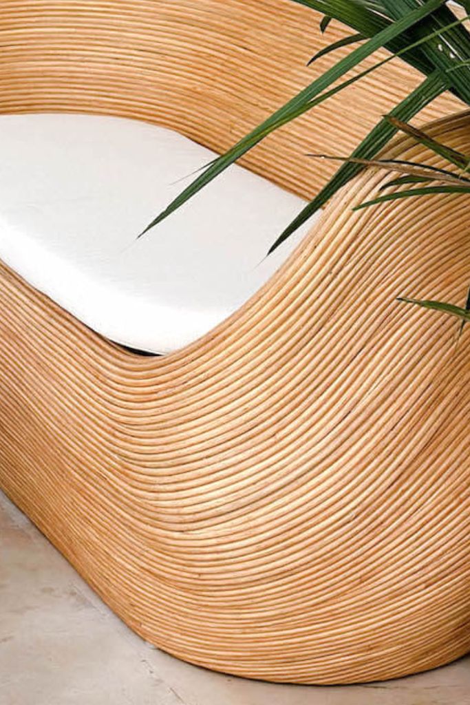 Handmade natural round rattan sofa Tegal with ecru cushions, designed for eco-friendly outdoor living on patios and terraces