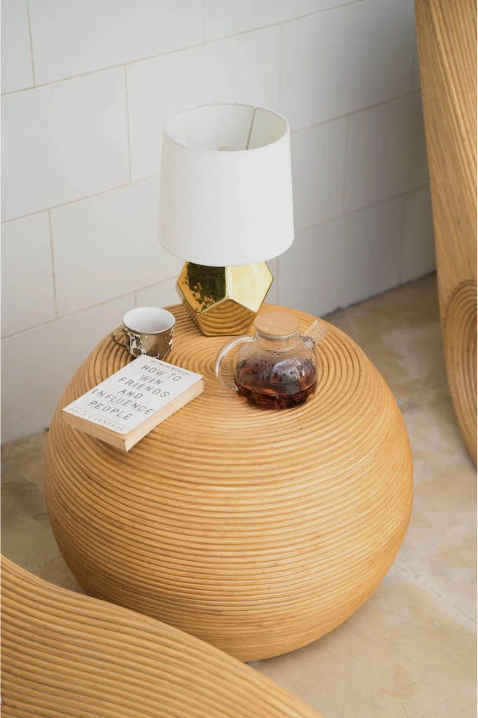 Multifunctional natural round rattan table for use as a coffee table, side table, or decorative piece