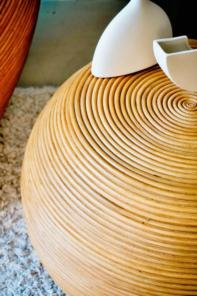 Multifunctional natural round rattan table for use as a coffee table, side table, or decorative piece