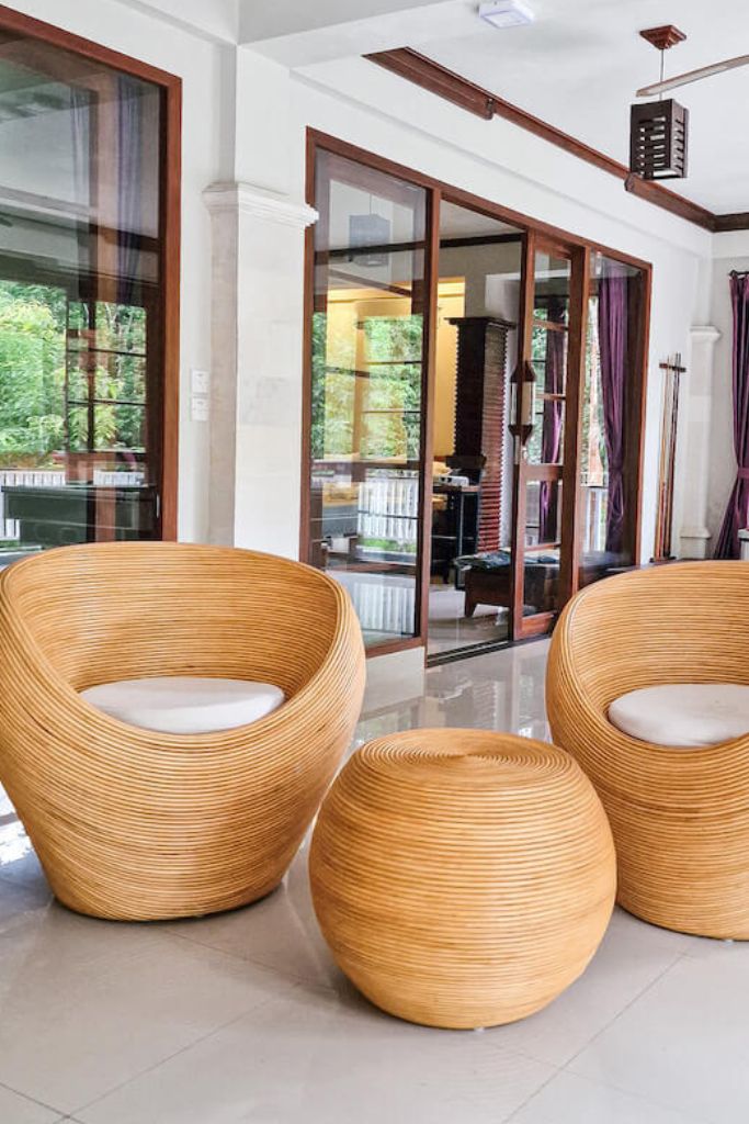 Multifunctional natural round rattan table for use as a coffee table, side table, or decorative piece