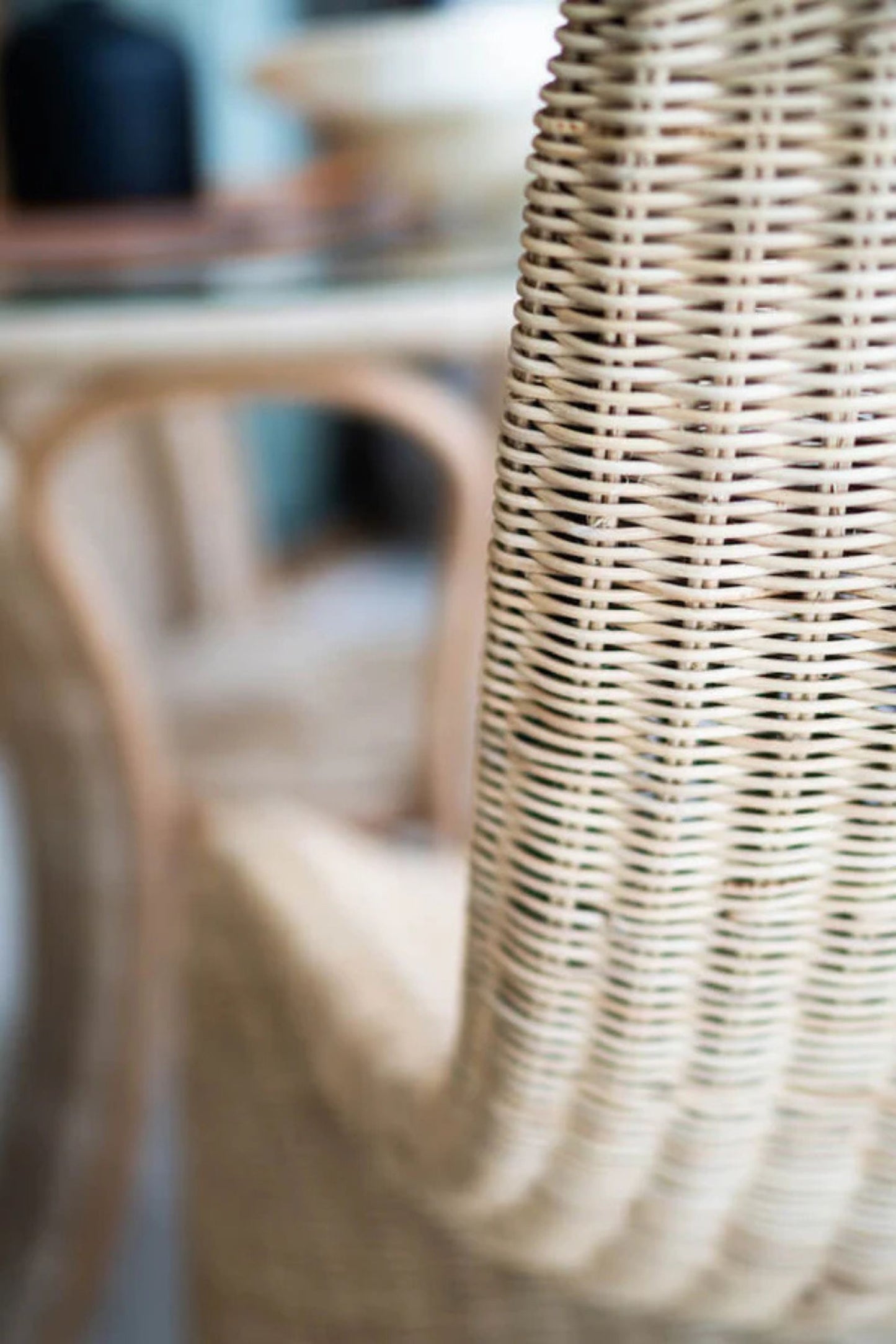 Oriana Collection handmade rattan chair with modern curved design, unique craftsmanship