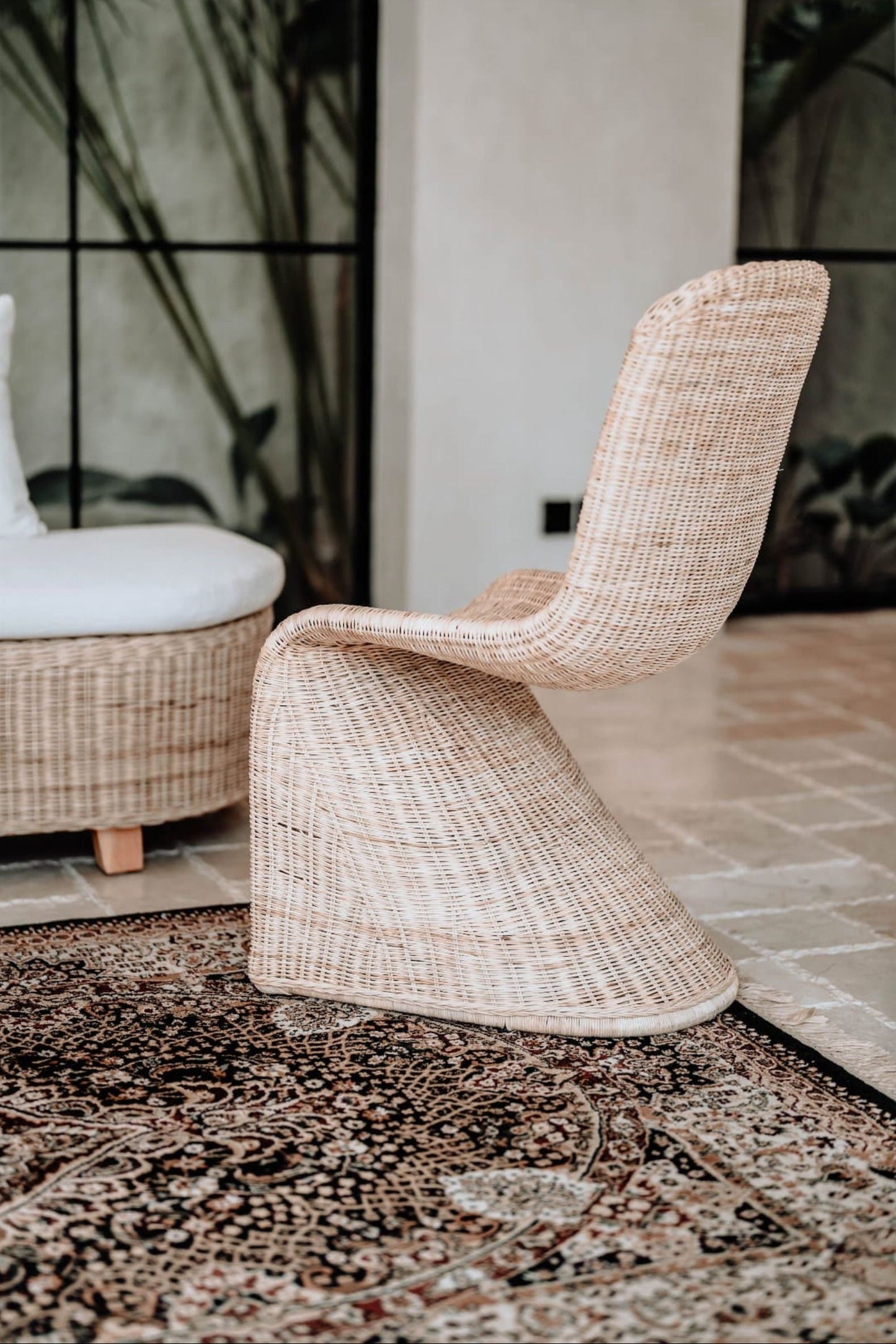 Oriana Collection handmade rattan chair with modern curved design, unique craftsmanship
