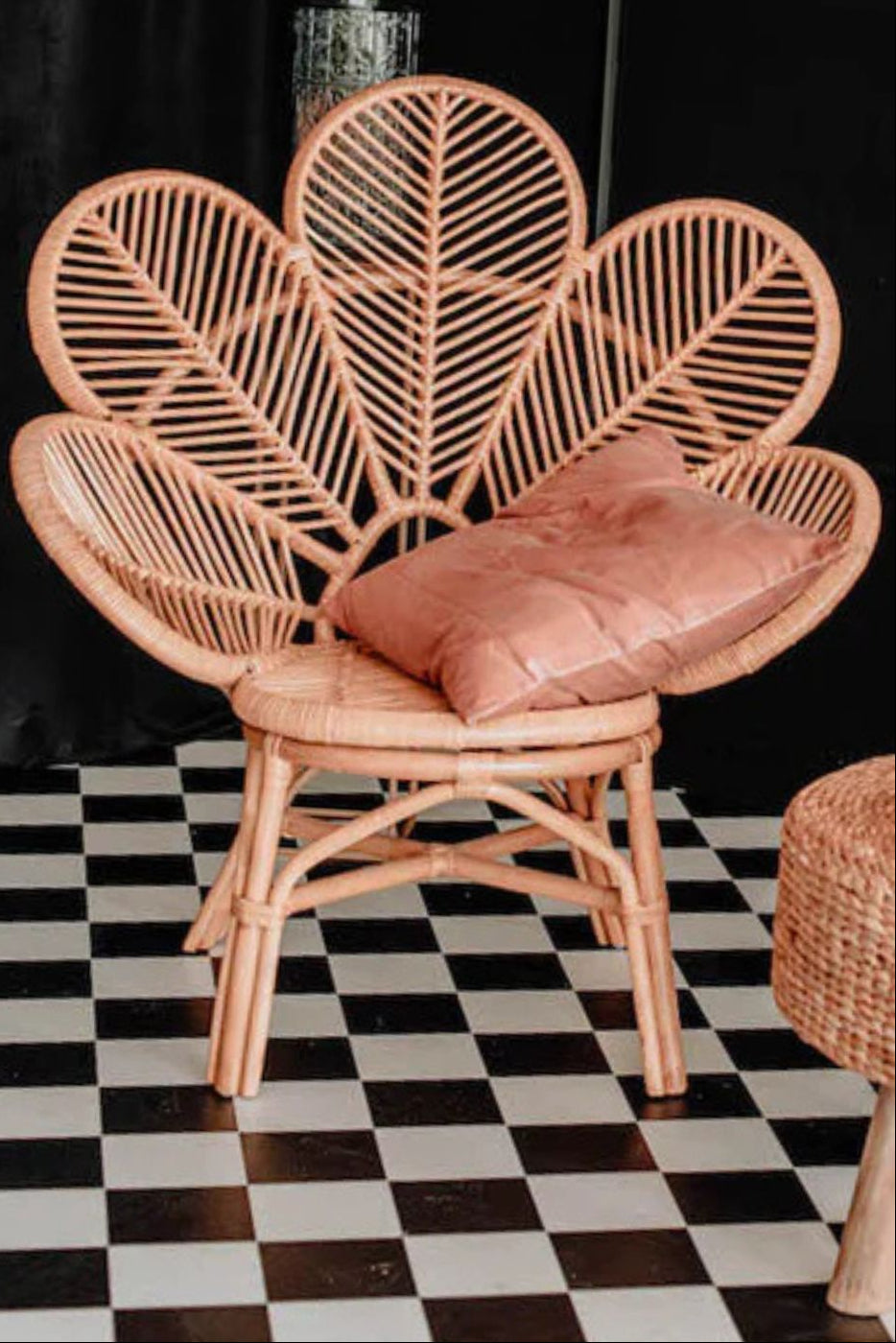 Rattan Monna Flower Chair featuring a handcrafted petal-shaped backrest and natural rattan weave, offering elegant bohemian style for indoor or outdoor spaces