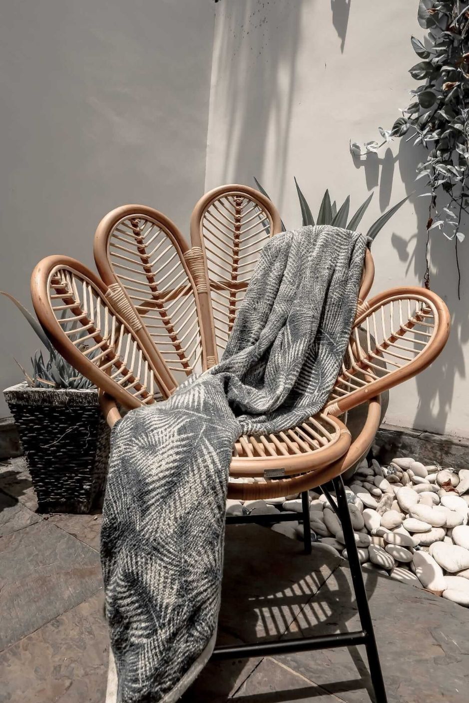Rattan Sia Flower Chair in natural finish - handcrafted bohemian furniture with a petal-shaped backrest and woven rattan design, ideal for living rooms, bedrooms, or outdoor spaces