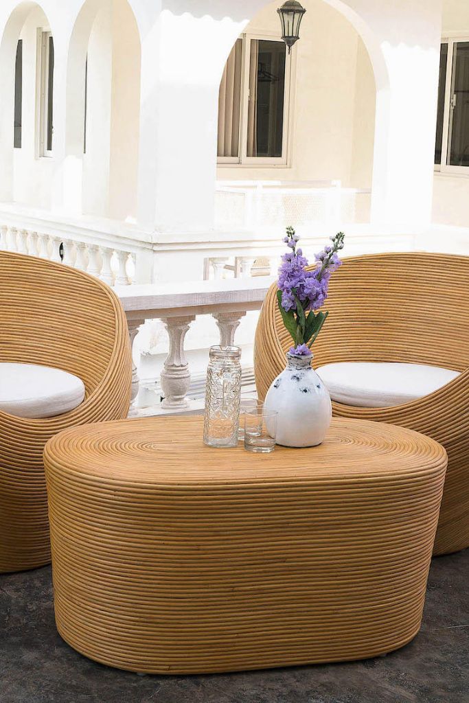 Tegal Oval Rattan Table in rich natural finish, handwoven from durable natural rattan for indoor or outdoor use