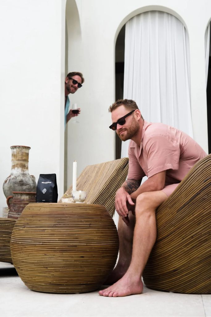 Multifunctional brown round rattan table for use as a coffee table, side table, or decorative piece