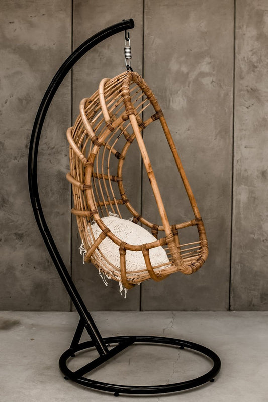 Durable handmade natural rattan hanging swing chair single, designed for relaxing indoor or outdoor comfort.