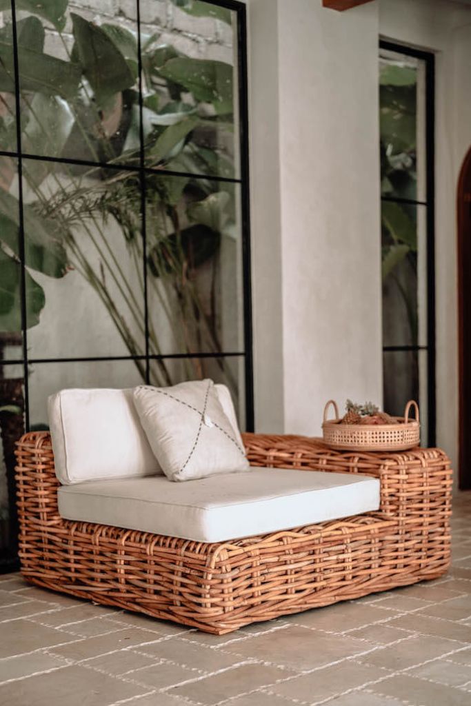Handmade Ingka modular armchair in cognac rattan with thick weave, versatile as standalone chair or part of modular sofa for living room, terrace, or patio.