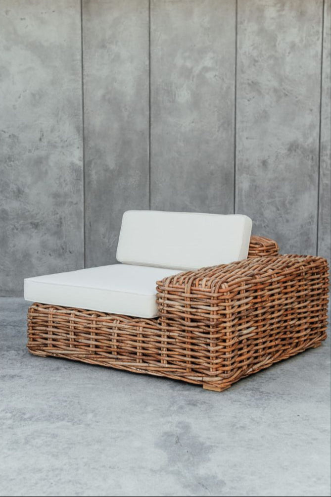 Handmade Ingka modular armchair in cognac rattan with thick weave, versatile as standalone chair or part of modular sofa for living room, terrace, or patio.