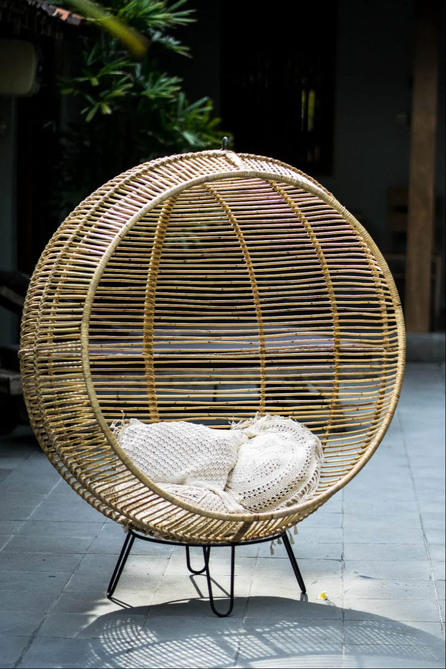 Hanging and standing rattan ball swing chair for adults and kids, available in single adult and junior sizes, handmade natural rattan, includes metal stand and rope, perfect for patio, garden, deck, or poolside, stylish boho, modern, and classic interior accessory.