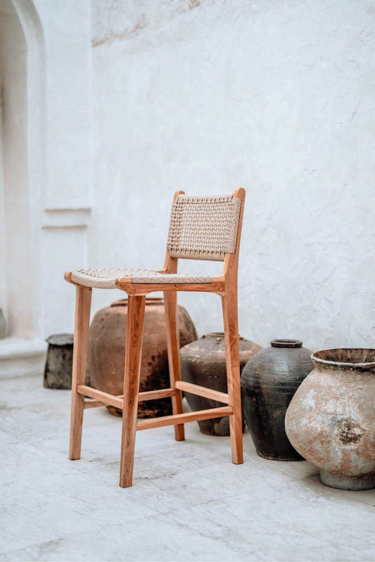 Handmade Harrison teak bar stool with woven synthetic seat and backrest, stylish and durable high chair for kitchen counters or bar tables, perfect for modern Australian interiors.
