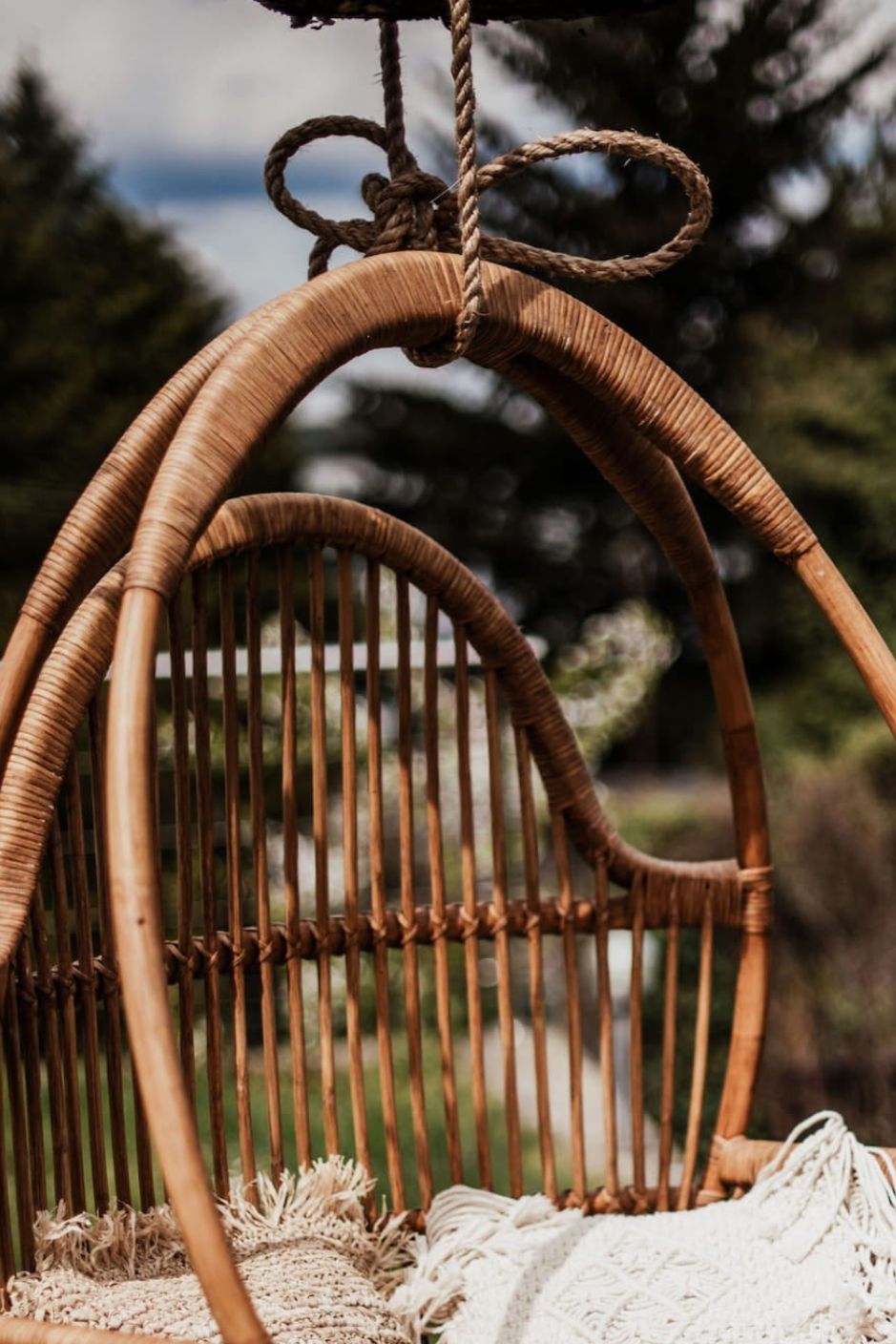 Henry single or double handmade durable cognac rattan hanging chair for indoor living rooms, covered terraces, patios, balconies, and outdoor gardens