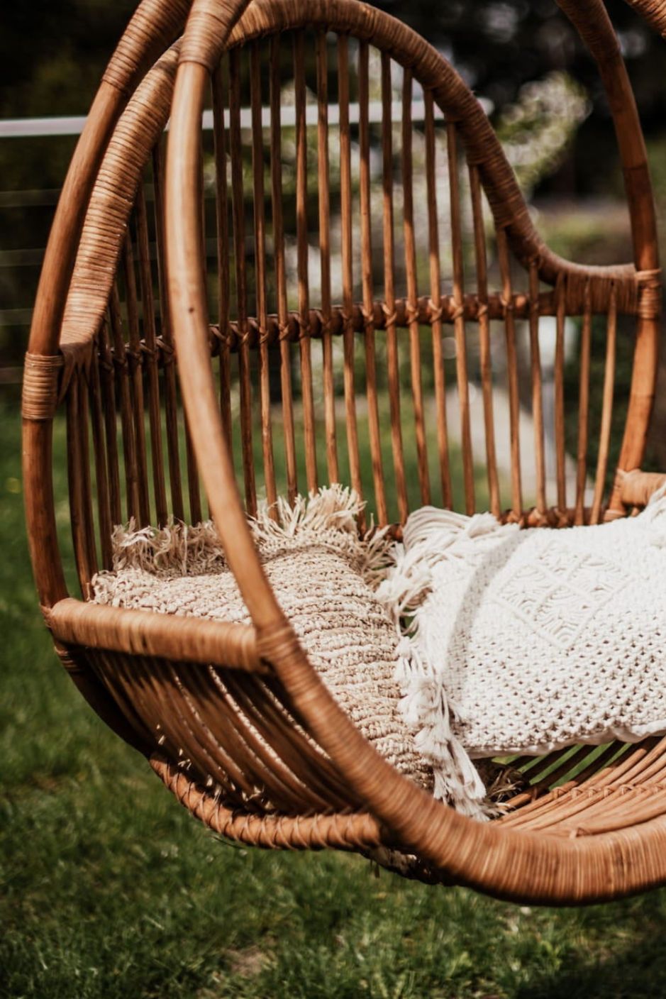 Henry single or double handmade durable cognac rattan hanging chair for indoor living rooms, covered terraces, patios, balconies, and outdoor gardens