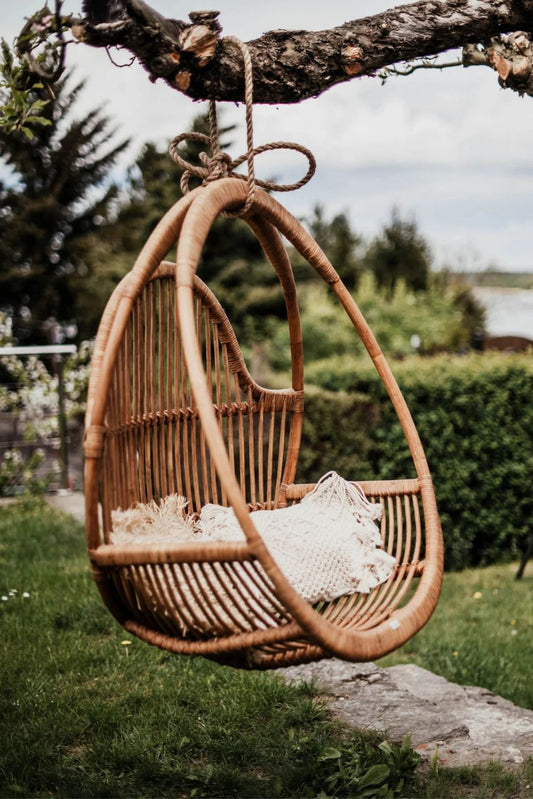 Henry single or double handmade durable cognac rattan hanging chair for indoor living rooms, covered terraces, patios, balconies, and outdoor gardens