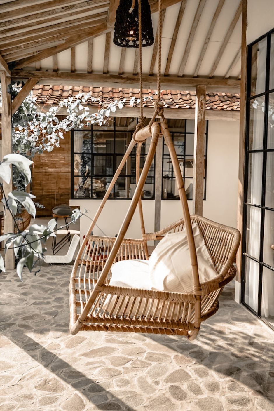 Henry single or double handmade durable light rattan hanging chair for indoor living rooms, covered terraces, patios, balconies, and outdoor gardens