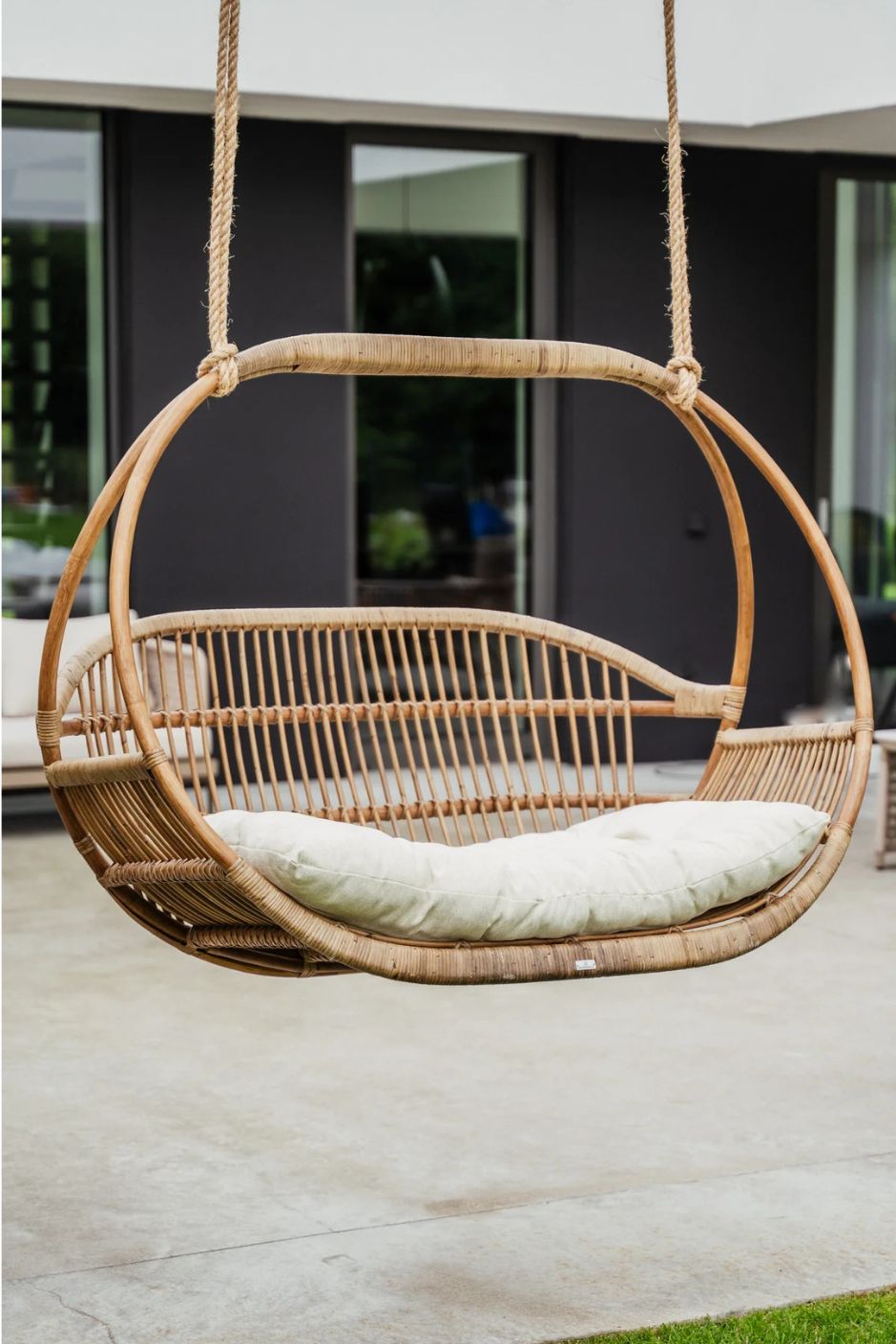 Henry single or double handmade durable light rattan hanging chair for indoor living rooms, covered terraces, patios, balconies, and outdoor gardens