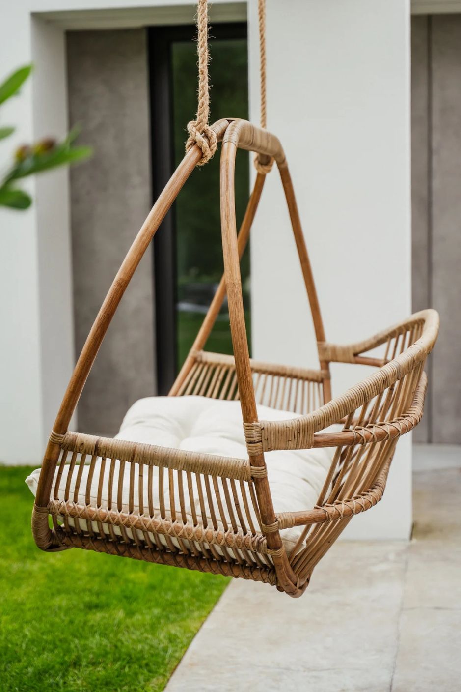 Henry single or double handmade durable light rattan hanging chair for indoor living rooms, covered terraces, patios, balconies, and outdoor gardens