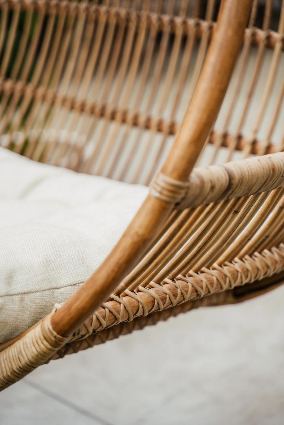 Henry single or double handmade durable light rattan hanging chair for indoor living rooms, covered terraces, patios, balconies, and outdoor gardens