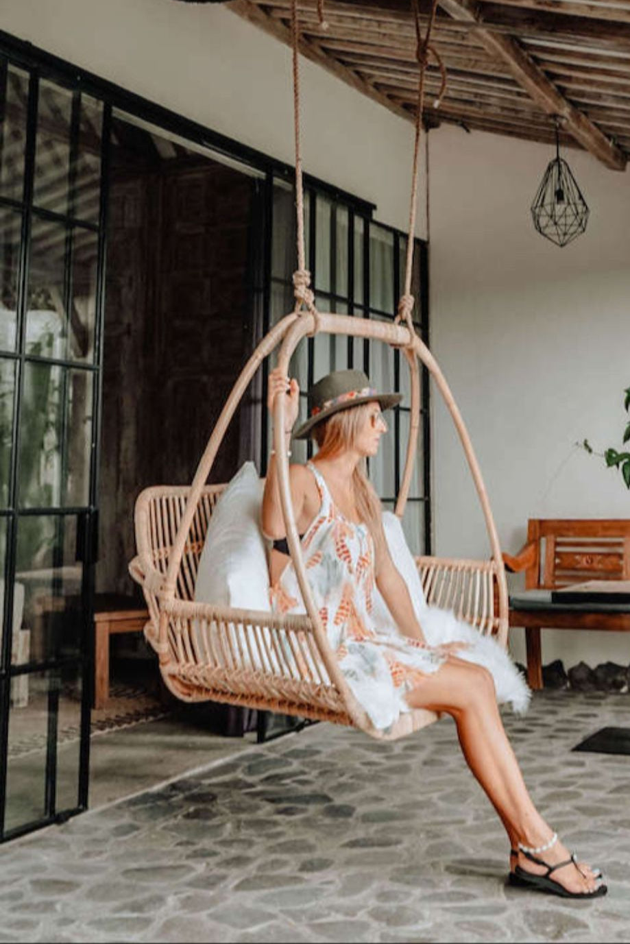 Henry single or double handmade durable light rattan hanging chair for indoor living rooms, covered terraces, patios, balconies, and outdoor gardens