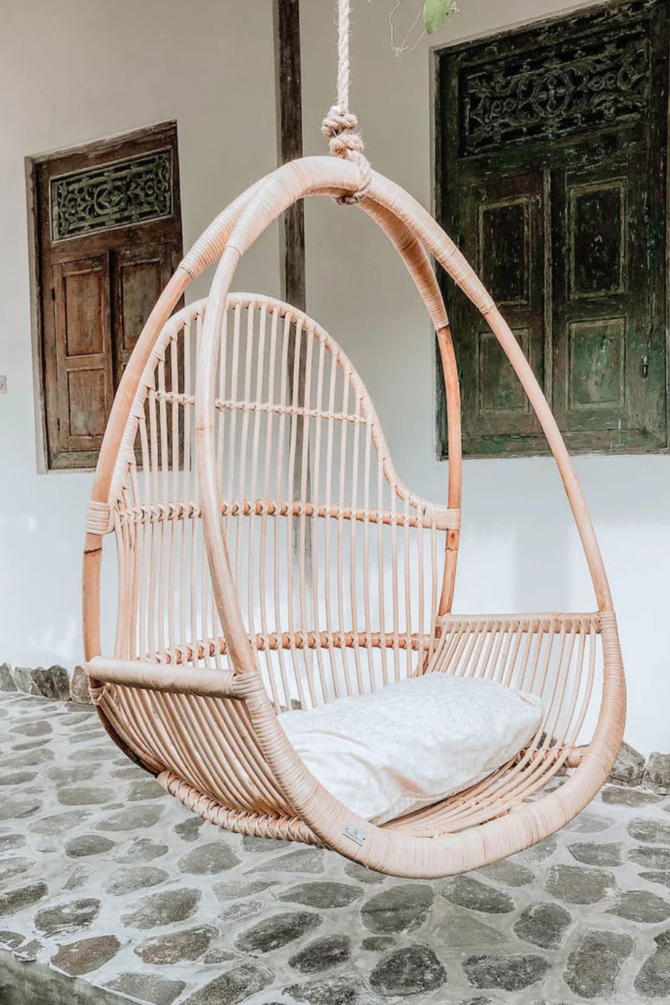 Henry single or double handmade durable light rattan hanging chair for indoor living rooms, covered terraces, patios, balconies, and outdoor gardens