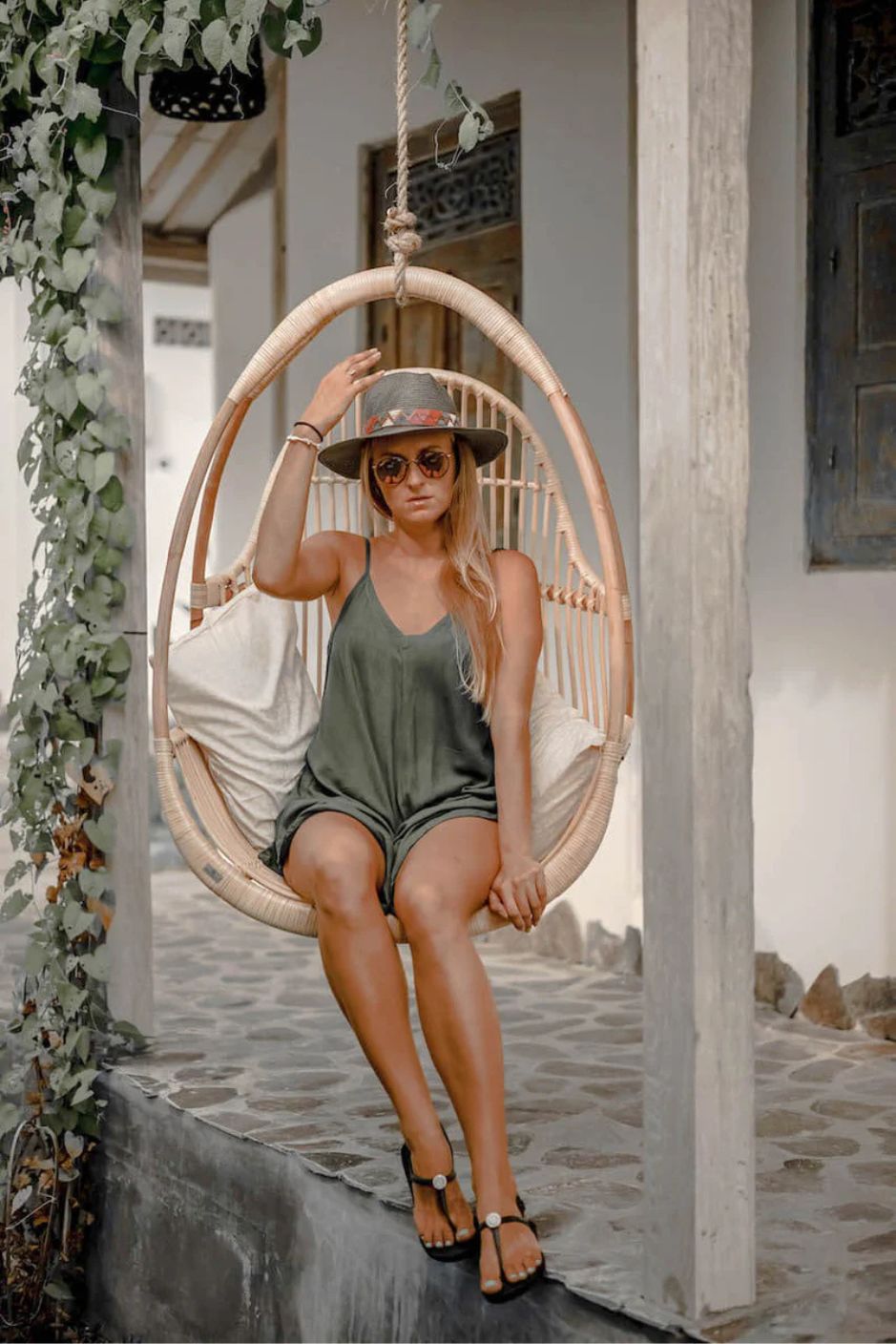 Henry single or double handmade durable light rattan hanging chair for indoor living rooms, covered terraces, patios, balconies, and outdoor gardens