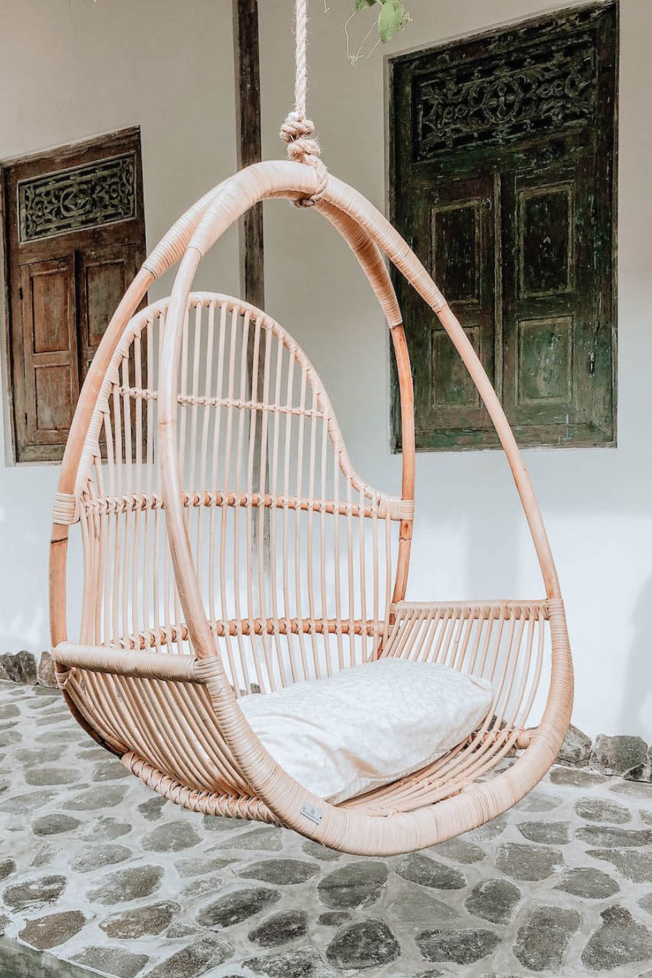 Henry single or double handmade durable light rattan hanging chair for indoor living rooms, covered terraces, patios, balconies, and outdoor gardens
