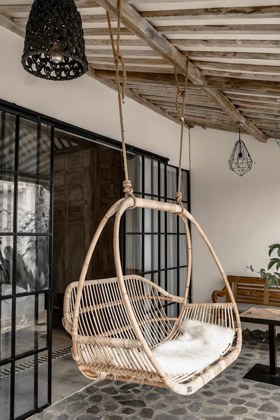 Henry single or double handmade durable light rattan hanging chair for indoor living rooms, covered terraces, patios, balconies, and outdoor gardens