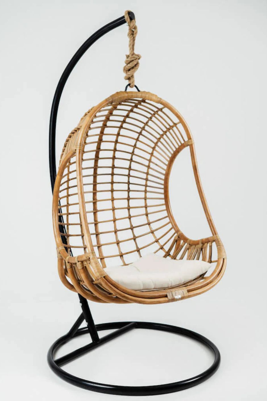 Hugo Rattan Hanging Chair in natural, cognac and brown rattan, handmade, eco-friendly, zero plastic, boho style, perfect for living room, terrace, or patio, stylish and comfortable swinging chair for modern or island-inspired interiors.