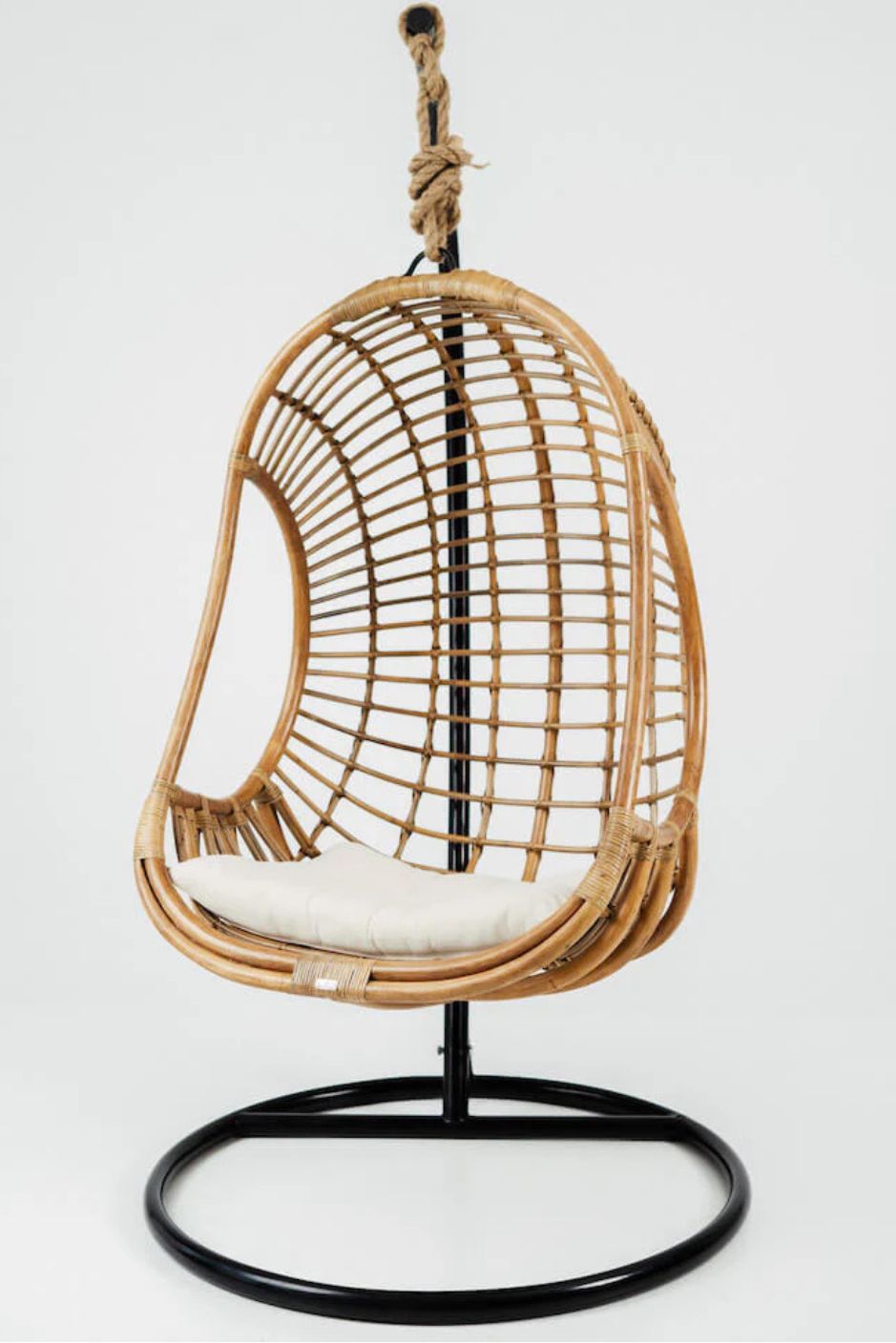 Hugo Rattan Hanging Chair in natural, cognac and brown rattan, handmade, eco-friendly, zero plastic, boho style, perfect for living room, terrace, or patio, stylish and comfortable swinging chair for modern or island-inspired interiors.