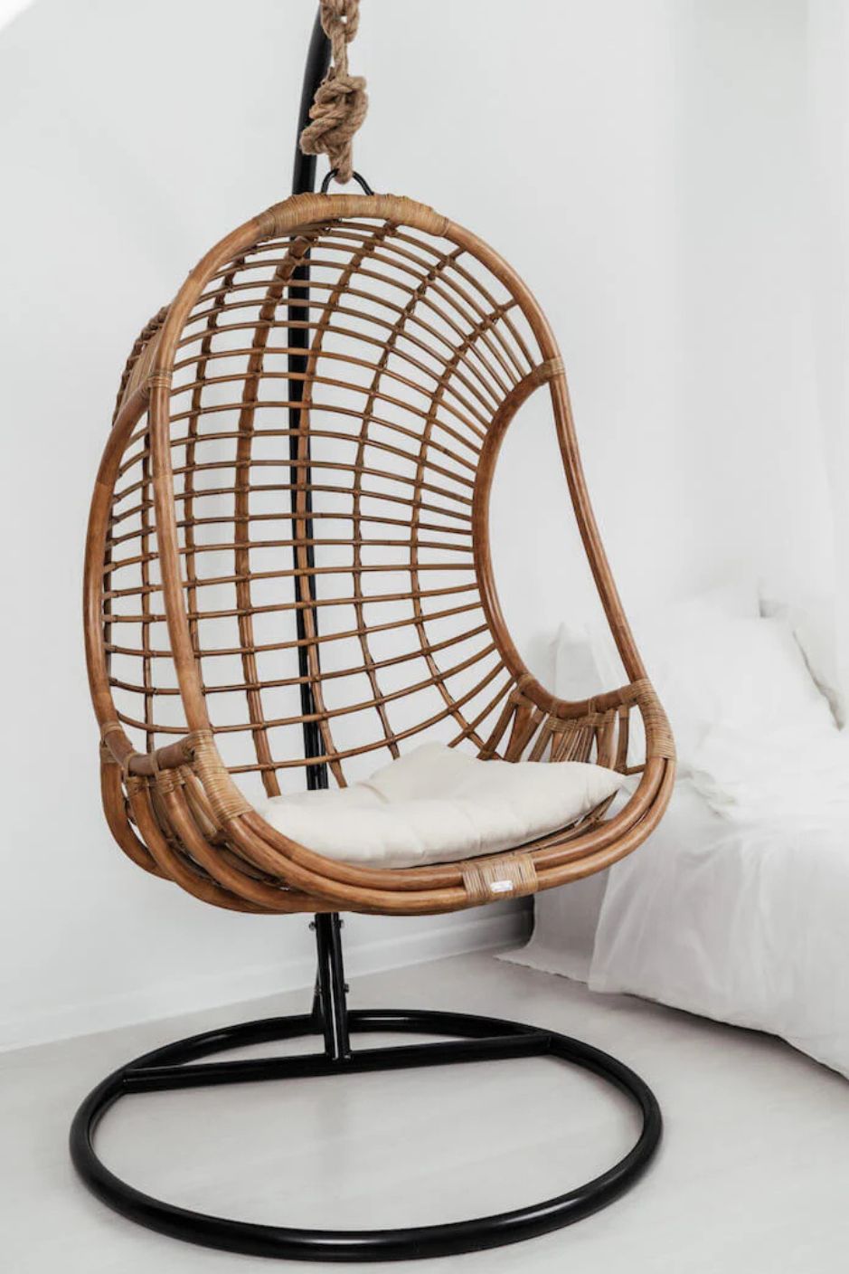Hugo Rattan Hanging Chair in natural, cognac and brown rattan, handmade, eco-friendly, zero plastic, boho style, perfect for living room, terrace, or patio, stylish and comfortable swinging chair for modern or island-inspired interiors.