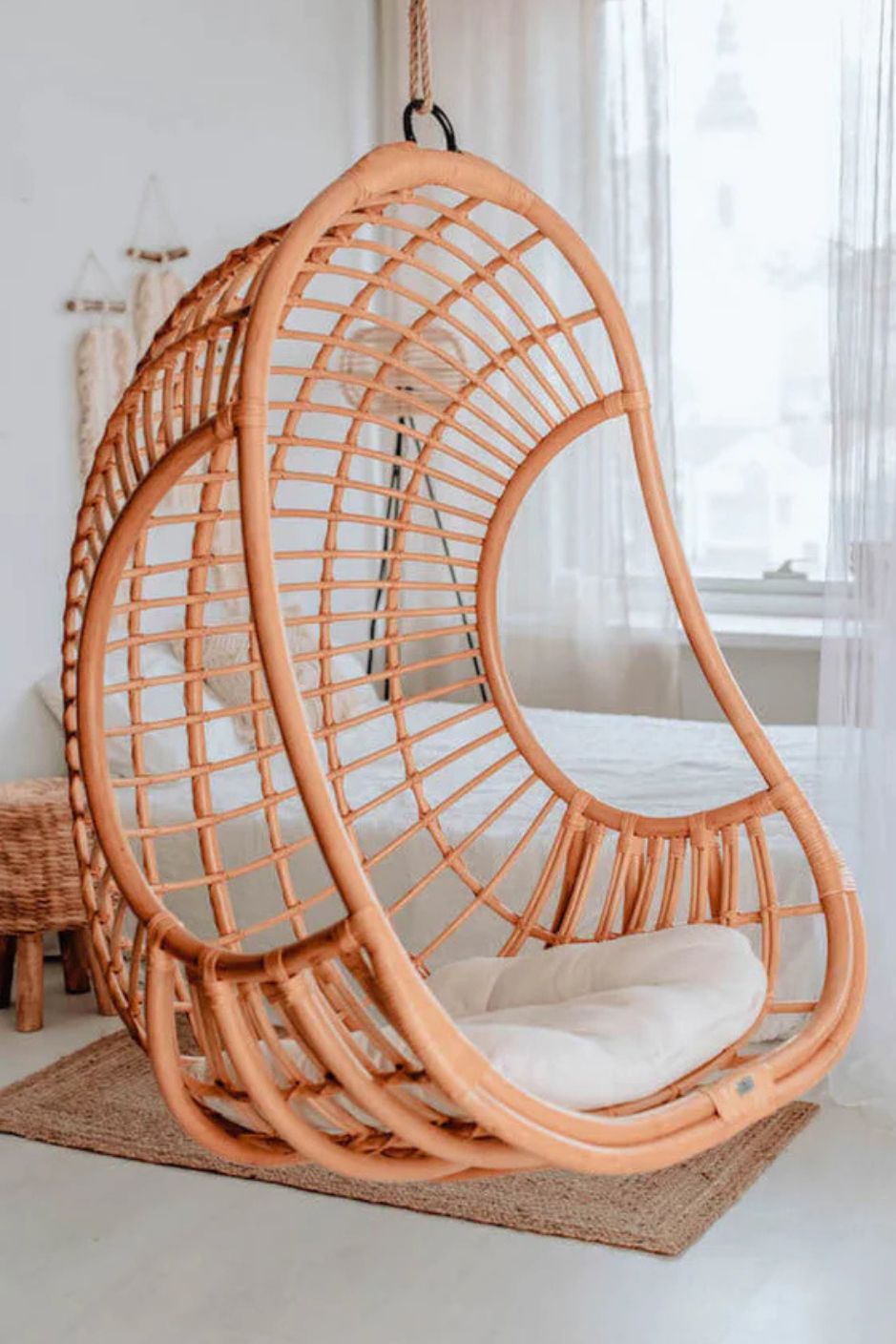 Hugo Rattan Hanging Chair in natural, cognac and brown rattan, handmade, eco-friendly, zero plastic, boho style, perfect for living room, terrace, or patio, stylish and comfortable swinging chair for modern or island-inspired interiors.