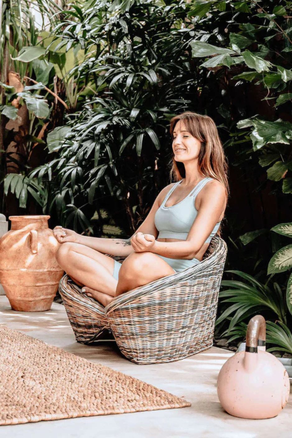 Indiana Yoga Chair handcrafted from sustainable rattan wood in natural and grey tones, ergonomic backrest and curved armrests for yoga, meditation, or relaxation, lightweight and eco-friendly indoor and outdoor seating