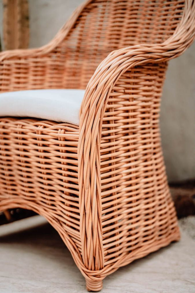 Handmade Ingka Alo cognac rattan chair with thick weave, natural tones, perfect for modern living spaces