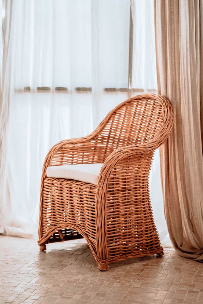 Handmade Ingka Alo cognac rattan chair with thick weave, natural tones, perfect for modern living spaces