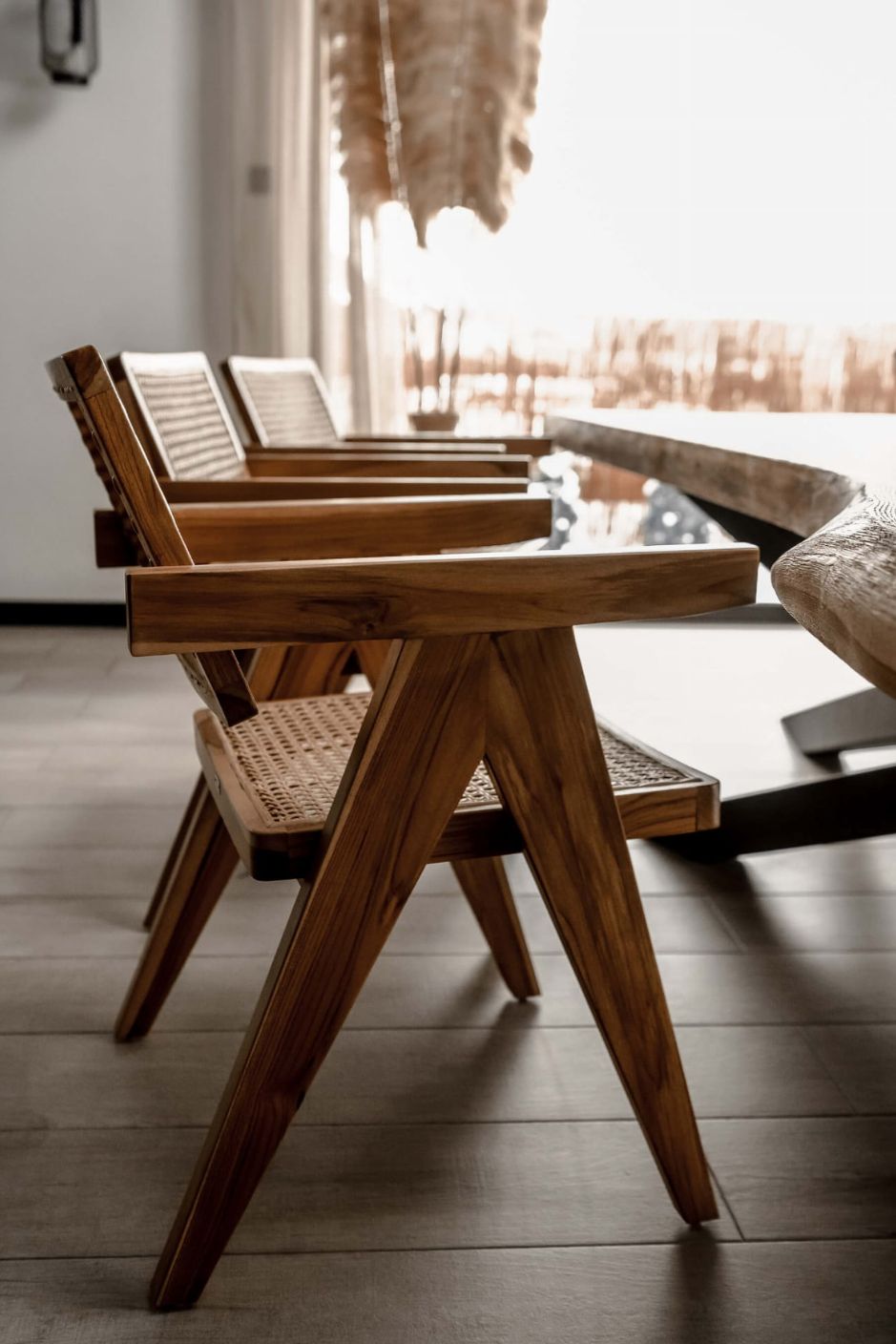 Joy Chair handmade from durable teak wood with woven rattan seat and backrest – stylish eco-friendly dining chair for modern homes.