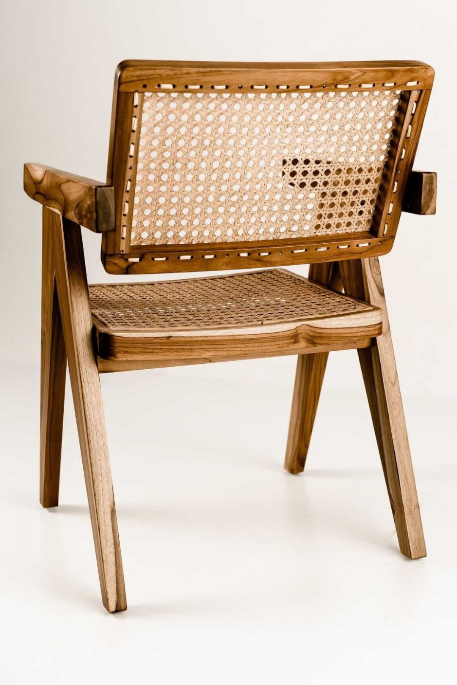  Joy Chair handmade from durable teak wood with woven rattan seat and backrest – stylish eco-friendly dining chair for modern homes.