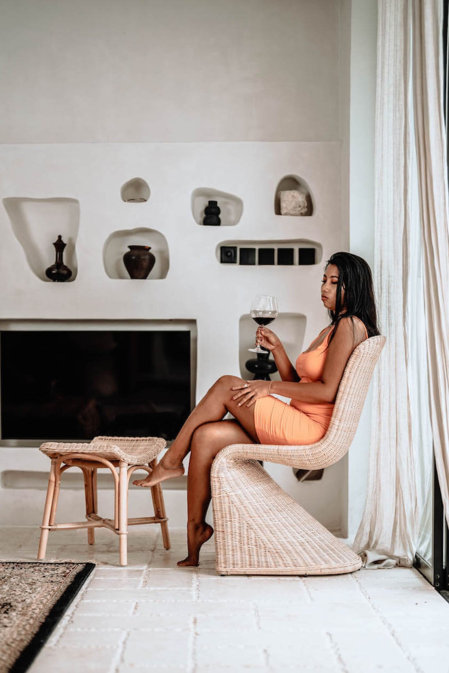 Oriana Collection handmade rattan chair with modern curved design, unique craftsmanship
